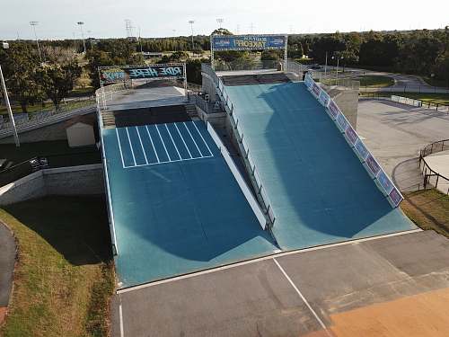 bmx park green ramp during daytime ramp